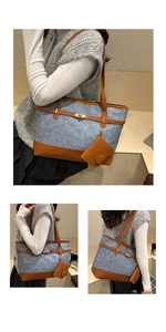 Detail of light blue denim tote with brown leather straps and gold buckle closure