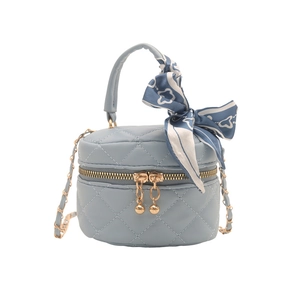 Quilted light blue cylinder bucket bag with chain strap and decorative silk scarf