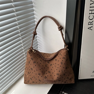 Brown corduroy tote bag with heart print and adjustable knot shoulder straps for women