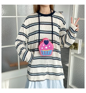 Detailed view of cupcake-shaped mini crossbody bag in pink and blue PU leather