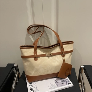 Canvas and brown leather tote bag with gold twist-lock and matching mini pouch