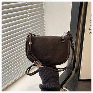 Close-up of matte dark brown crossbody bag with Tianyun Acai logo and silver zipper details