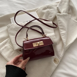 Mini wine red patent leather handbag with gold lock and thin shoulder strap