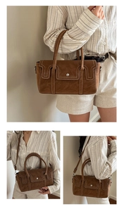 Détails du sac en daim marron avec surpiqûres blanches et fermoir en métal doré