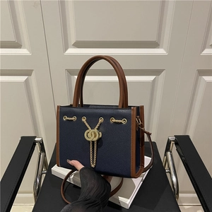 Navy blue and brown leather tote bag with gold chain and large capacity for daily use