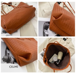 Detailed view of caramel brown woven tote bag showing texture and spacious interior storage
