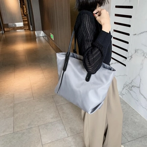 Fashionable grey large capacity nylon tote bag with black leather straps for women