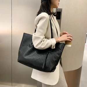 Classic black woven leather tote bag with large capacity for women in minimalist style