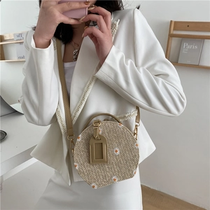 Sac bandoulière rond en paille tressée avec broderies marguerites et sangle en PU