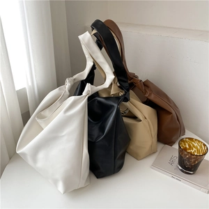 Minimalist soft leather tote bags in four colors with knot detail and large capacity