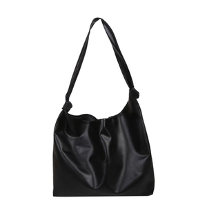 Minimalist black soft PU leather tote bag with knot detail and large capacity for women