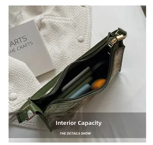 Detail view of olive green hobo bag showing spacious interior for phones and wallet