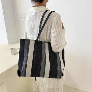 Chic oversized striped canvas tote bag with black shoulder straps for daily casual wear