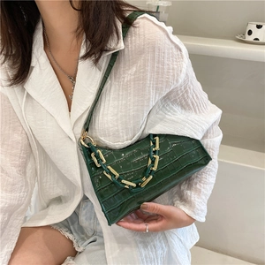 Dark green faux crocodile skin baguette bag with gold chunky chain and leather strap