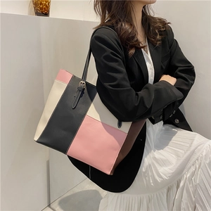 Fashionable patchwork PU leather tote bag shown on a model for a chic commute style