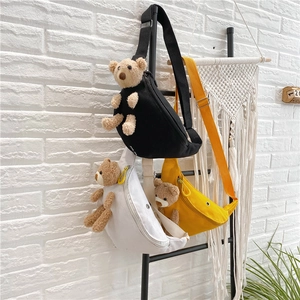 Cute canvas crossbody chest bag with plush bear decoration in black white and yellow