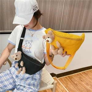 Cute canvas chest bag for women with plush bear detail, available in black and yellow