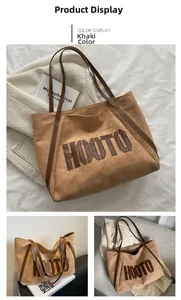 Macro detail of khaki suede tote bag with brown leather straps and HOOTO letter patch