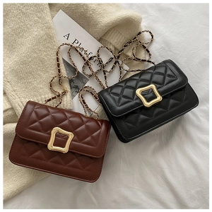 Detail of quilted diamond pattern and golden chain strap on stylish faux leather bags