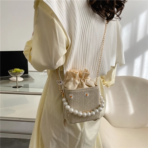 Straw woven bucket bag with pearl handle and daisy embroidery for spring summer