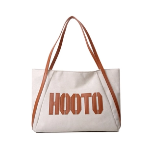 Winter faux suede tote bag with brown leather straps and HOOTO letter detail in white