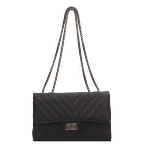Classic black chevron quilted crossbody bag with metal chain strap and twist lock