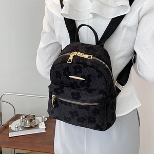 Mini sac à dos noir pour femme avec jacquard floral et fermetures éclair en métal doré
