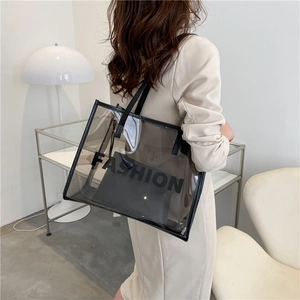 Transparent black PVC tote bag with FASHION lettering and a matching inner pouch