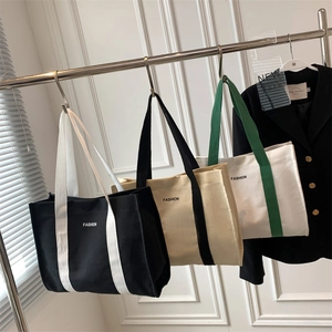 Large canvas tote bag with fashion lettering and contrast handles in three colors