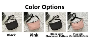 Collection of nylon crescent crossbody bags in black and pink with checkerboard charms