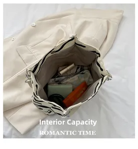Spacious interior of zebra stripe canvas tote bag showing large capacity for daily items