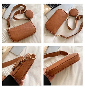 Detail view of amber brown embossed crossbody bag with detachable round coin purse