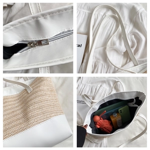 Detail view of the linen woven tote bag showing zipper closure and leather shoulder straps