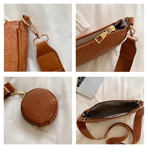 Detail view of brown textured underarm bag featuring a wide strap and mini round pouch