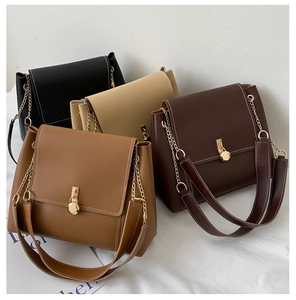 Detailed flat lay of crossbody bags in black, beige, coffee, and khaki with gold hardware
