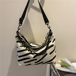 Minimalist canvas tote bag with zebra stripes and acrylic chain strap for women