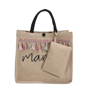 Fashionable jute tote bag with mama print, colorful tassels, and a small pouch