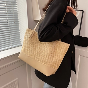 Large beige woven straw tote bag with PU leather straps for summer beach vacations