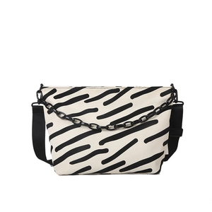Minimalist striped canvas tote bag with adjustable strap and decorative chain