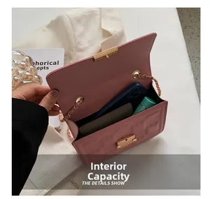 Interior view of pink leather crossbody bag showing space for phone and wallet