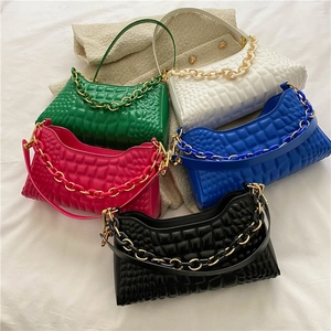 Contrast baguette shoulder bag with bold chain detail in green, blue, pink, and white