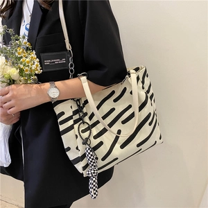 Large capacity striped canvas tote bag with black hand-drawn stripes and checkerboard charm