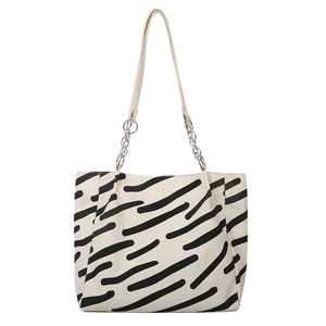 Minimalist canvas tote bag with black hand-drawn stripes and silver chain leather strap