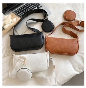 Three textured shoulder bags in black, brown, and white with matching round coin purses