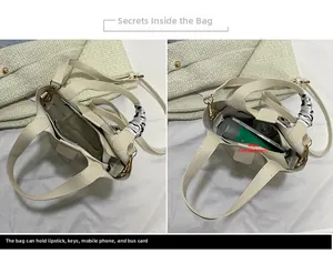 Detail view of cream white bucket bag interior showing main zipper compartment and storage