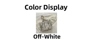 Detail of cream-white tote bag featuring elegant teal floral jacquard and slim straps