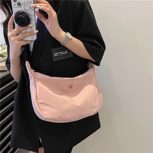 Pink nylon hobo crossbody bag for women with minimalist half-moon design and B-logo