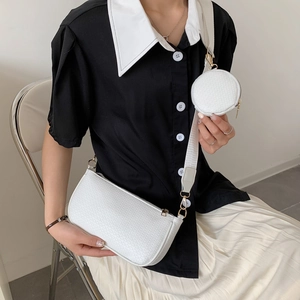 White textured shoulder bag with detachable mini pouch and gold hardware accents