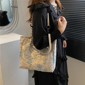 Vintage floral canvas tote bag with leather chain handles and spacious minimalist design