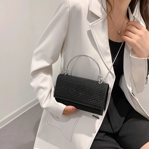 Sparkly rhinestone square handbag with silver circular handle and metal chain strap